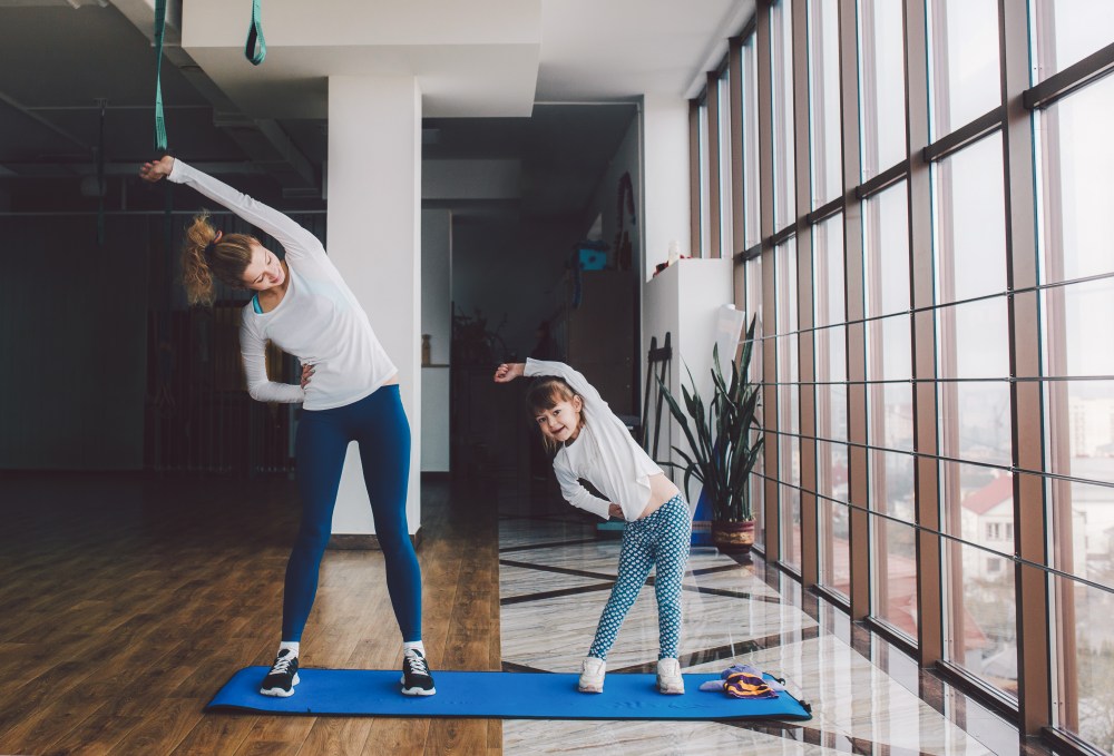 Two girls of different ages makeing yoga